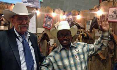 Jim Liles and 1982 World Champion Bull Rider, Charlie Sampson at the Riggins N Rhymes NFR Exhibit.