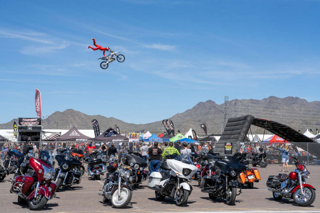 Stunt rider soaring through the air at Arizona Bike Week.