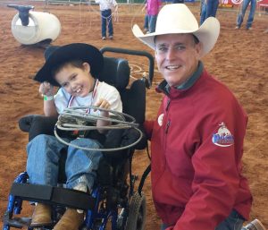 Cole along with PRCA Rodeo Announcer, Dan Fowlie, at the Queen Creek Roots N' Boots 2014 Special Kids Rodeo