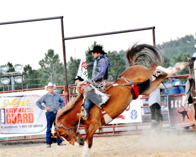 Saddle Bronc rider, Jesse Bail at the 5th annual Sturgis Wild West Days in 2013