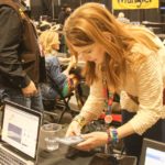 Gretchen Kirchamann texting at the at the 2014 Wrangler NFR Press Room