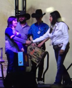 Justin Boots presents their gifts to Hannah and Jake