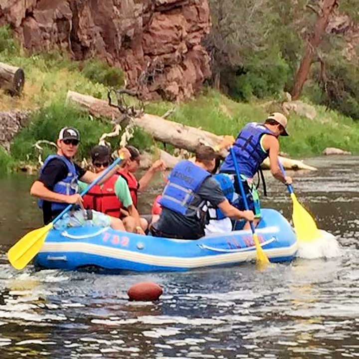 Tyler Milligan rafting with fellow Oklahoma High School Rodeo Team Members in Rock Springs, Wyoming during the 2014 National High School Rodeo Finals.