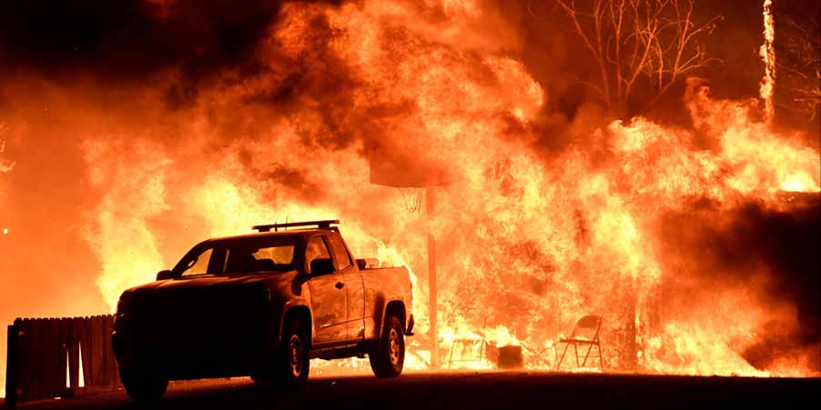 Schools and freeways closed, thousands of people forced to flee as multiple wildfires tear through Southern California