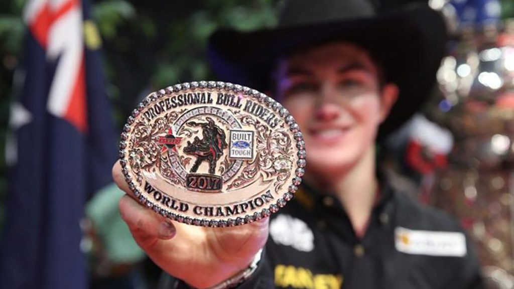 The 2017 PBR World Champ, Jess Lockwood, shows off his $20,000 Montana Silversmiths trophy. Photo Credit: ANDY WATSON, Bull Stock Media