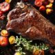 top down photo of a new york strip steak on iron skillet