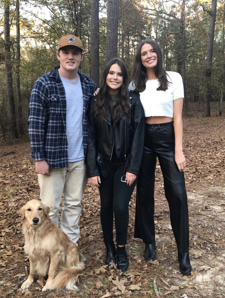 Pictured, younger brother Will Hickman, Mary Heather Hickman, younger sister, Audrey Hickman & their family golden retriever, Emmy.