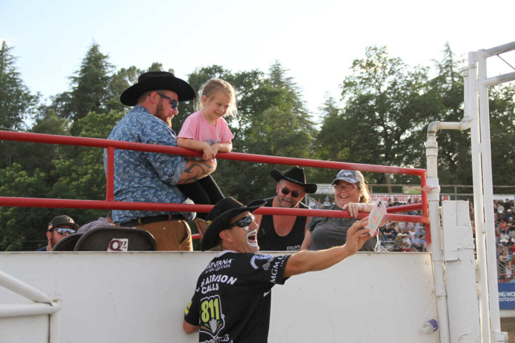 Pictured: JJ Harrison with rodeo fans - Photo Credit: Cowboy Lifestyle Network