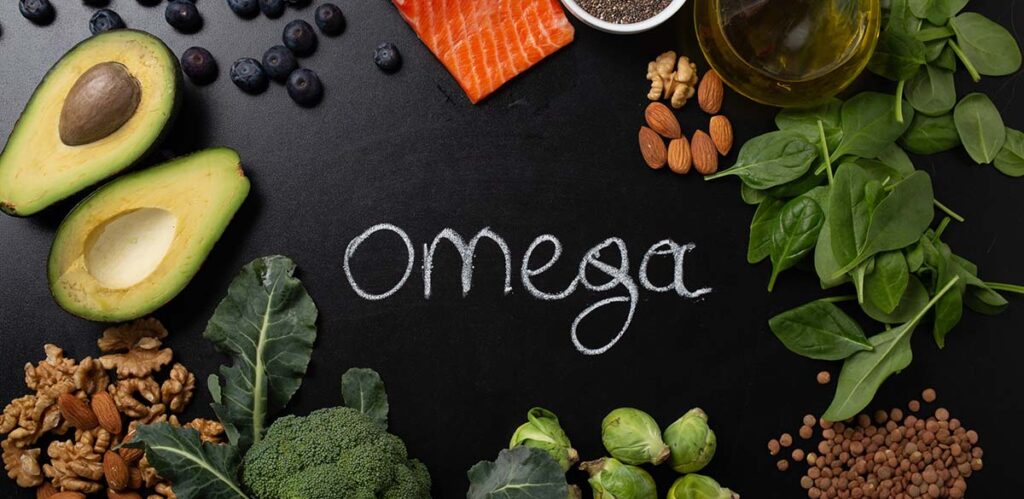 Healthy food with good fat sources, ingredients rich in omega fatty acids: salmon, vegetables, berries, nuts, seeds, olive oil