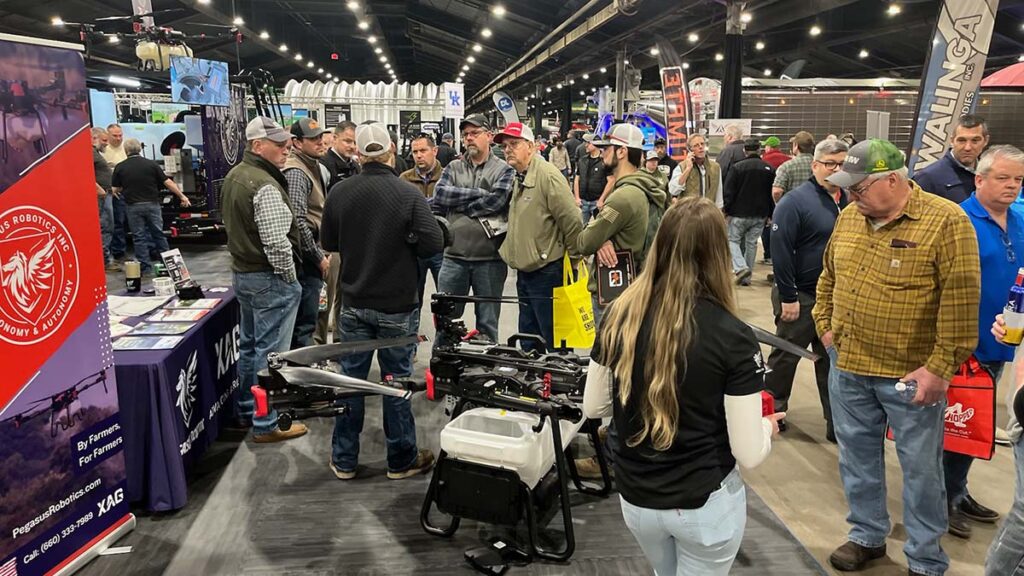 Pegasus Robotics' Lead Precision Agriculture Coach and Co-Founder, Davin York, leverages his extensive spray drone expertise to enlighten interested farmers at the National Farm Machinery Show in Kentucky.