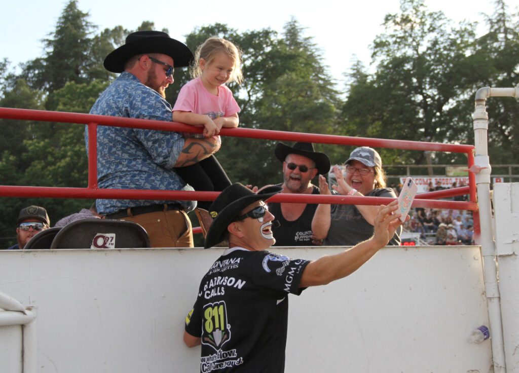Kid laughing with rodeo clown at Redding Rodeo
