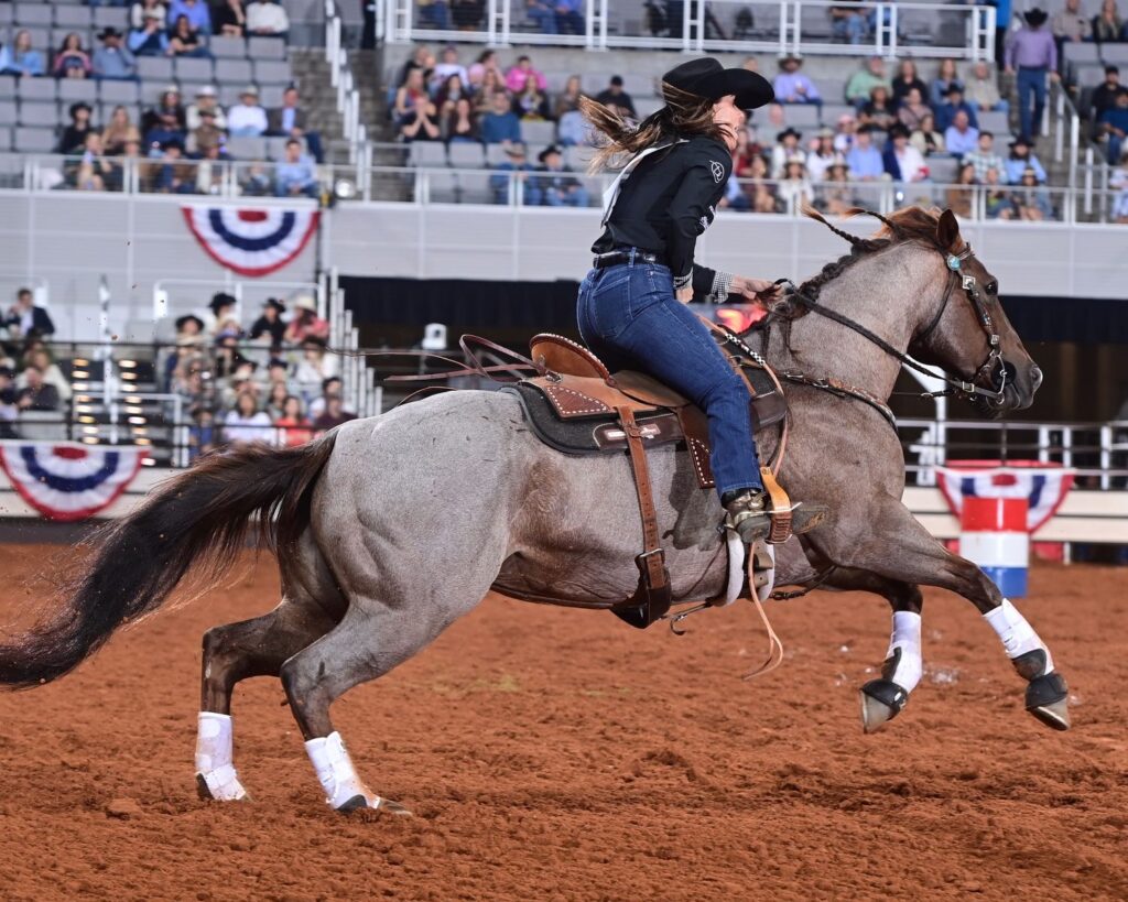 Andrea Busby, who had the fastest total time at the 2024 National Finals Rodeo in December riding her horse Benny, is having success at the Fort Worth Stock Show & Rodeo's ProRodeo Tournament with a different partner. The Brock, Texas, cowgirl and her seven-year-old red roan mare called Derby won Semi-finals A with 16.20. The duo also won the first round of Bracket 7 and have a chance to win the championship on Saturday. FWSSR photo by James Phifer