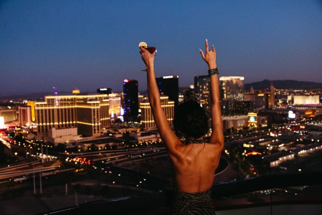 Woman looking at spectacular views from the rooftop at Voo Doo lounge