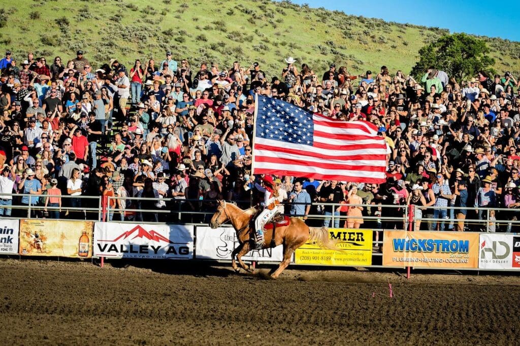 Rodeo Queen carrying the American Flag during opening ceremonies.