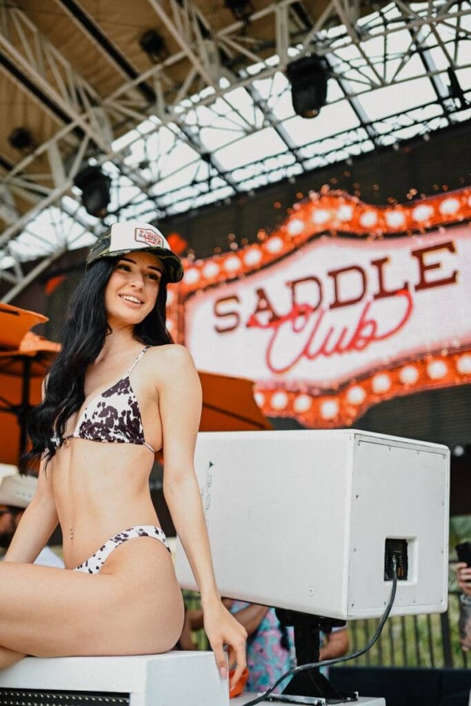 Cowgirl with cow print bikini at Daylight Saddle Club