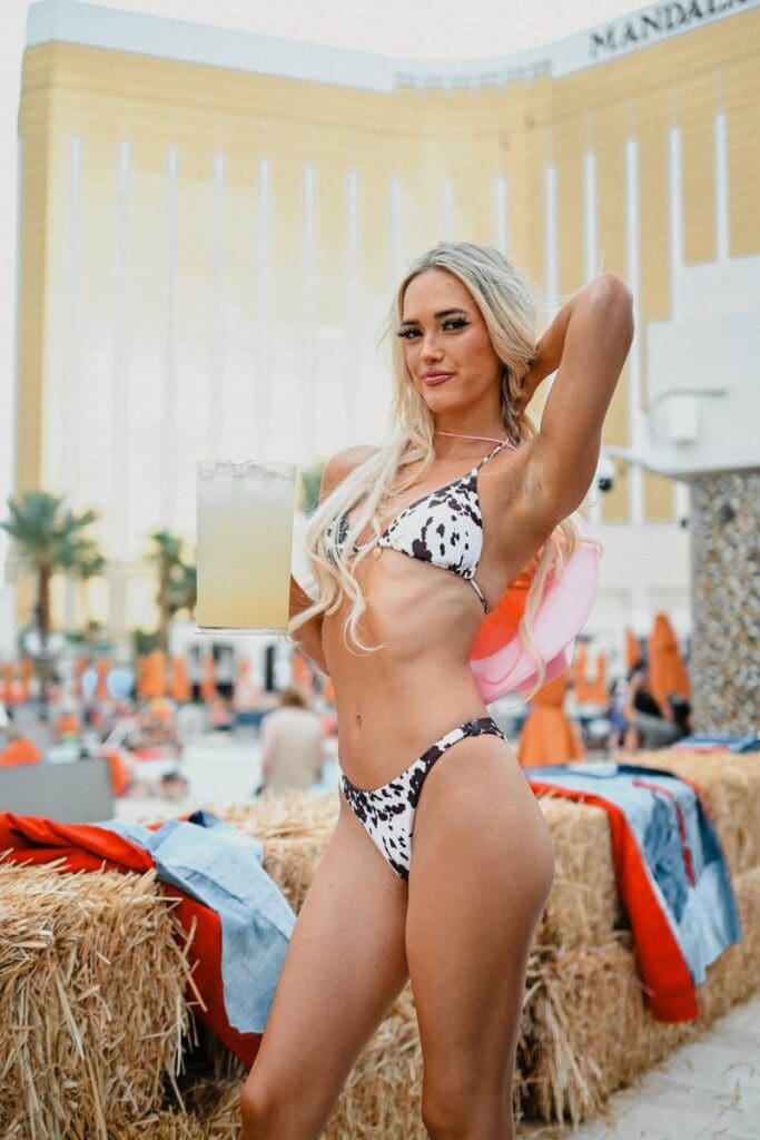 Girl in cow print bikini serving up refreshments at Daylight Saddle Club