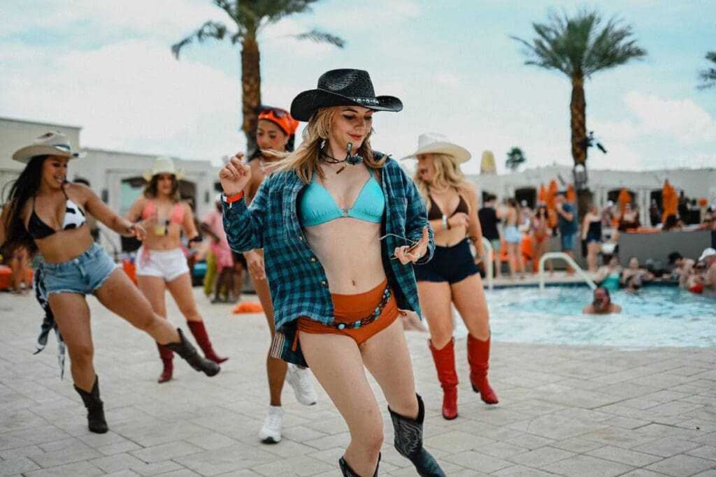 Line dancing poolside at Daylight Saddle Club