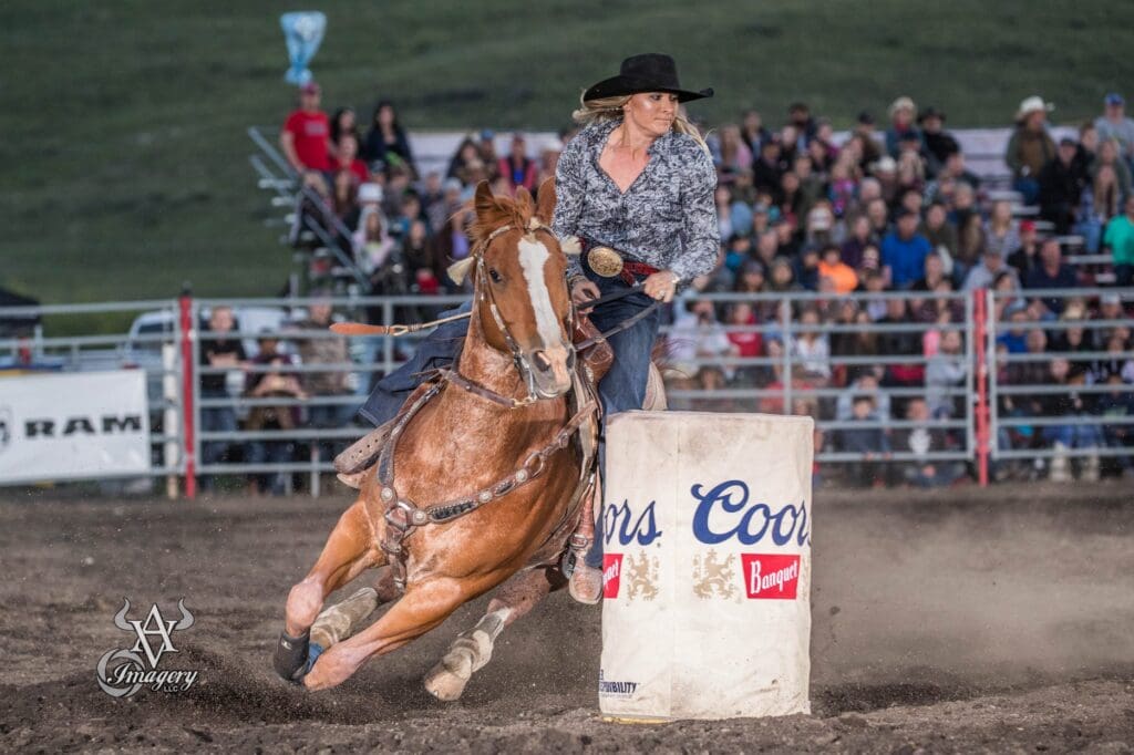 Barrel Racer turning around a barrel at The Eagle Rodeo