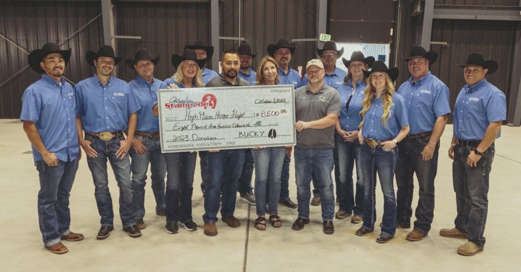 Greeley Rodeo Committee holding donation check for local organization