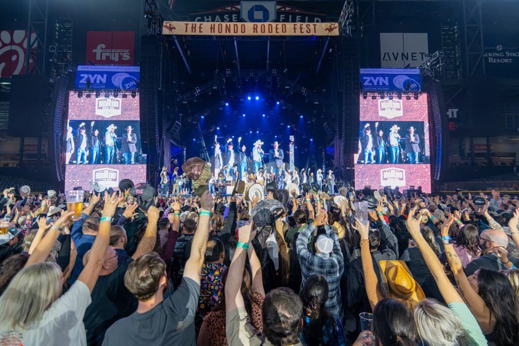Fans enjoying a performance at The Hondo Rodeo