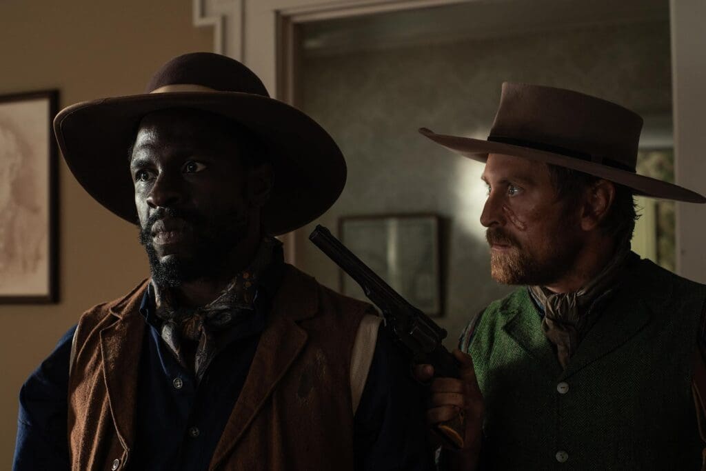 Gbenga Akinnagbe and Eric Nelsen in Trail of Vengeance (2025)
