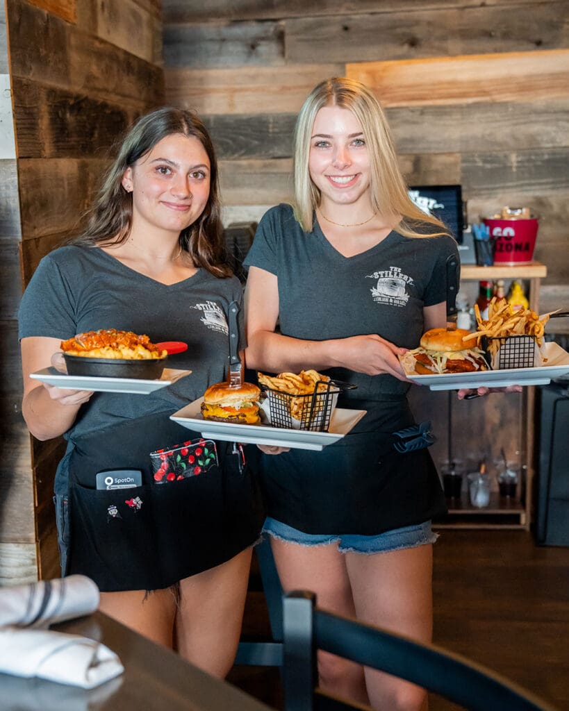 Servers with food at The Stillery