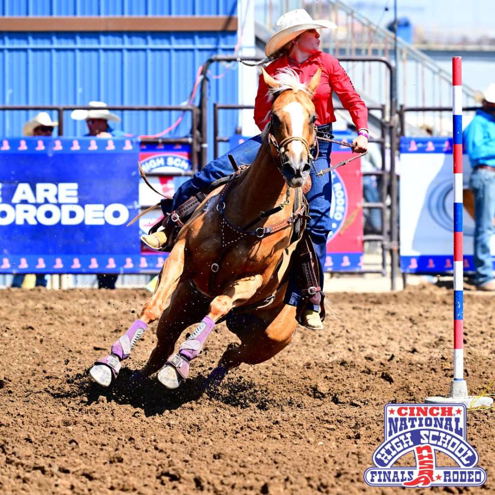Pole bending athlete riding her horse at National High School Finals Rodeo