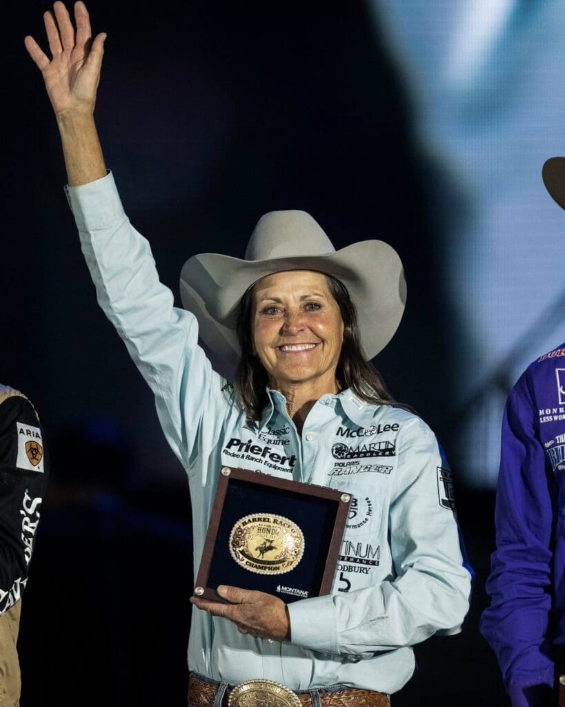 Lisa Lockhart taking home the Barrel Racing buckle at The Hondo