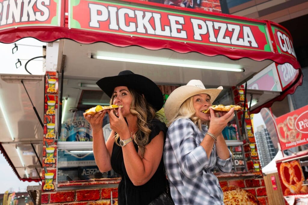 Fair attendees enjoying carnival food