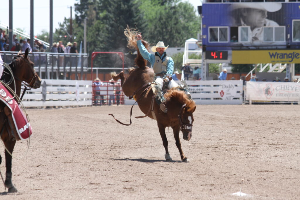 Bronc rider competing