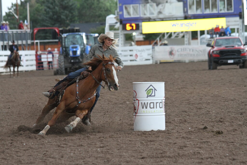 Barrel racer turning a barrel