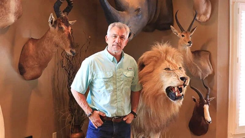 Bob Coker with his mounted lion he hunted