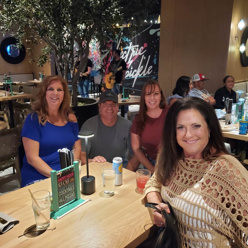 Friends gathering at Electric Pickle Country Nights