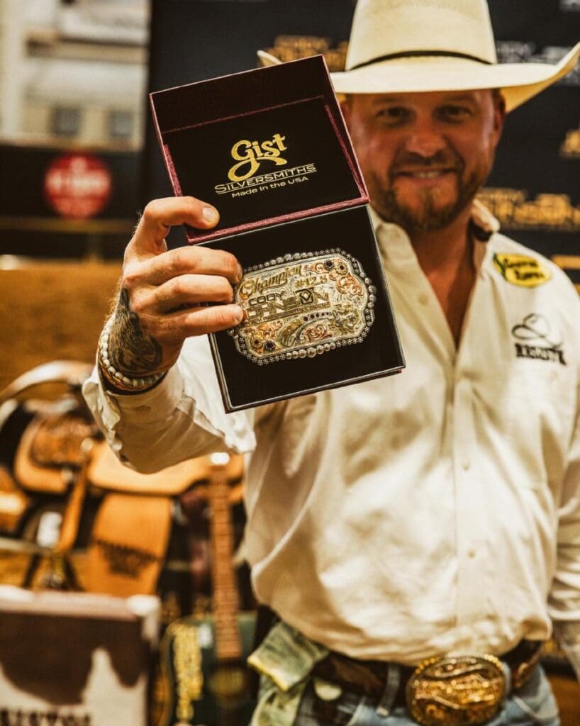 Cody Johnson with Gist Silversmiths Belt Buckle.  One of the prizes awarded at the COJO Championship Event.  