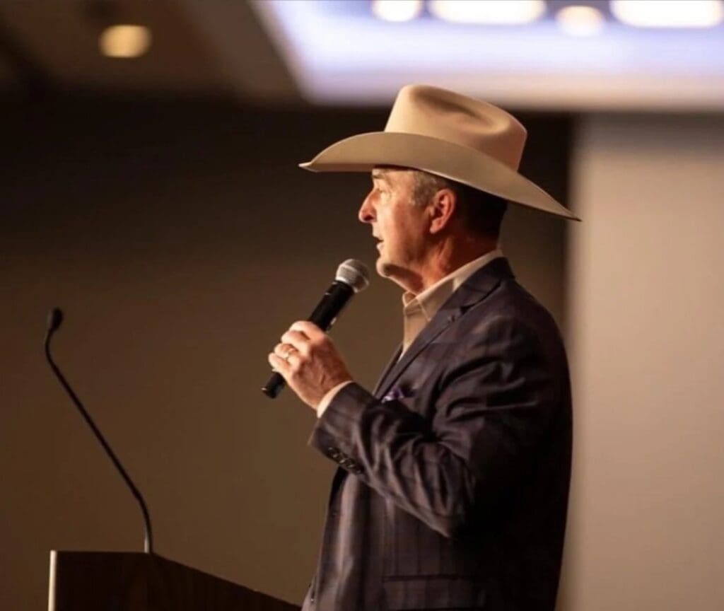 Justin McKee holding a microphone