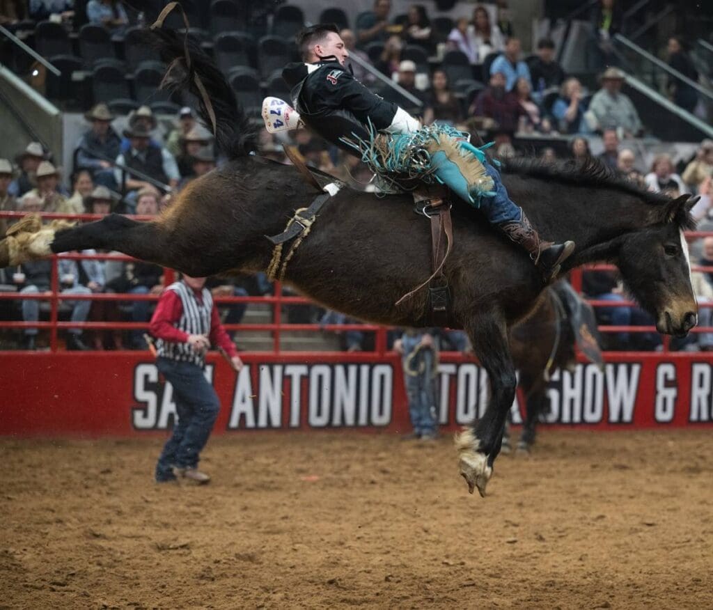 Jesse Pope Bareback riding a bronc