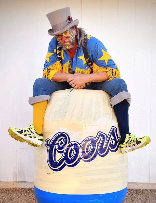 Barrel Man sitting on a barrel. Photo from CLN Media.