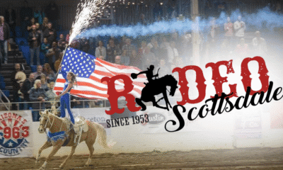Trick Rider carrying the American Flag in the arena at Rodeo Scottsdale