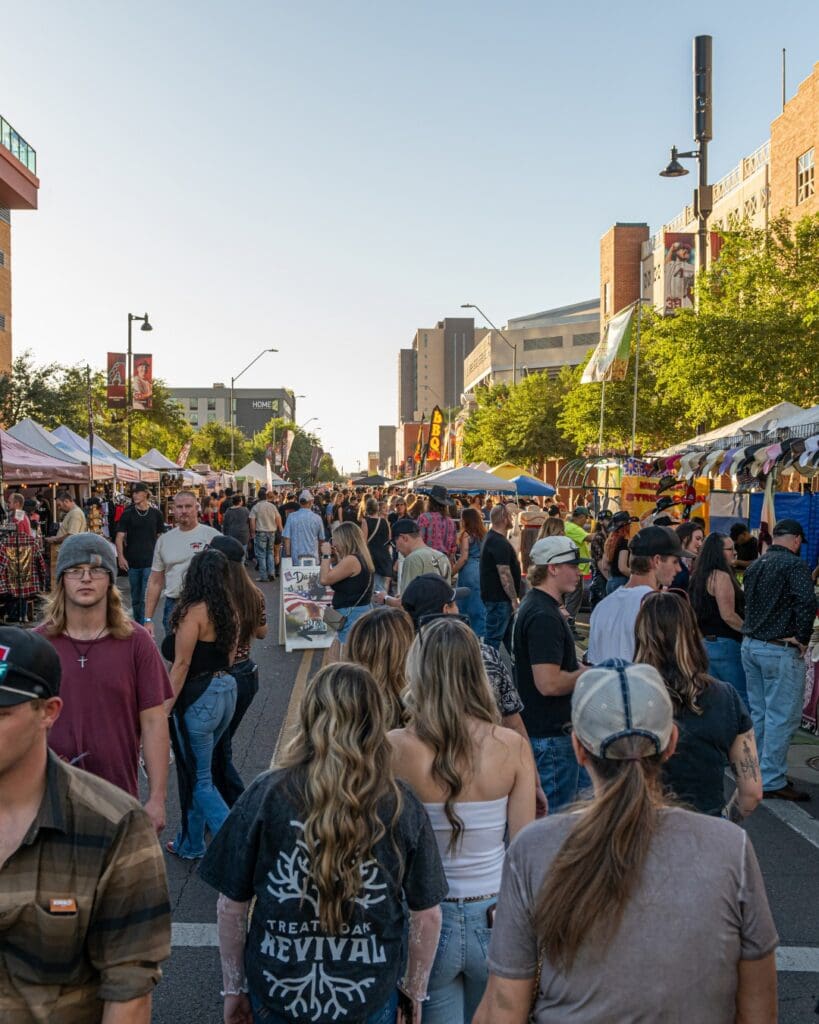 View of Hondo Street Fest, people and vendors