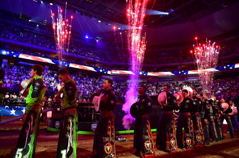 PBR competitors lined up in the arena