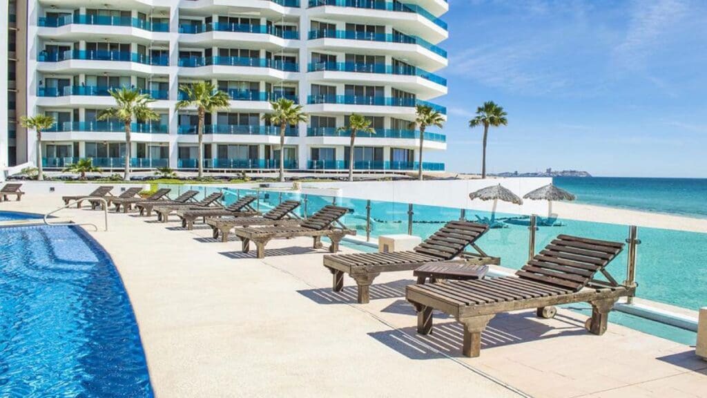 Beach chair lining the pool overlooking the beach.  Esmeralda-Rocky-Point-Mexico 