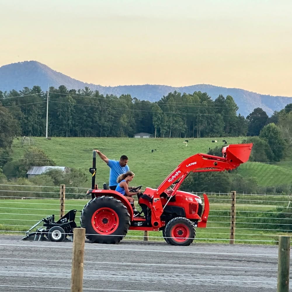 tractor in front of cameo fencing