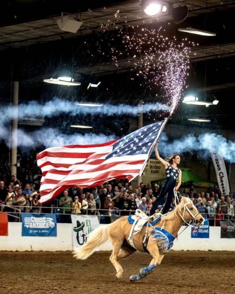Fireworks while presenting the American Flag on horseback.  