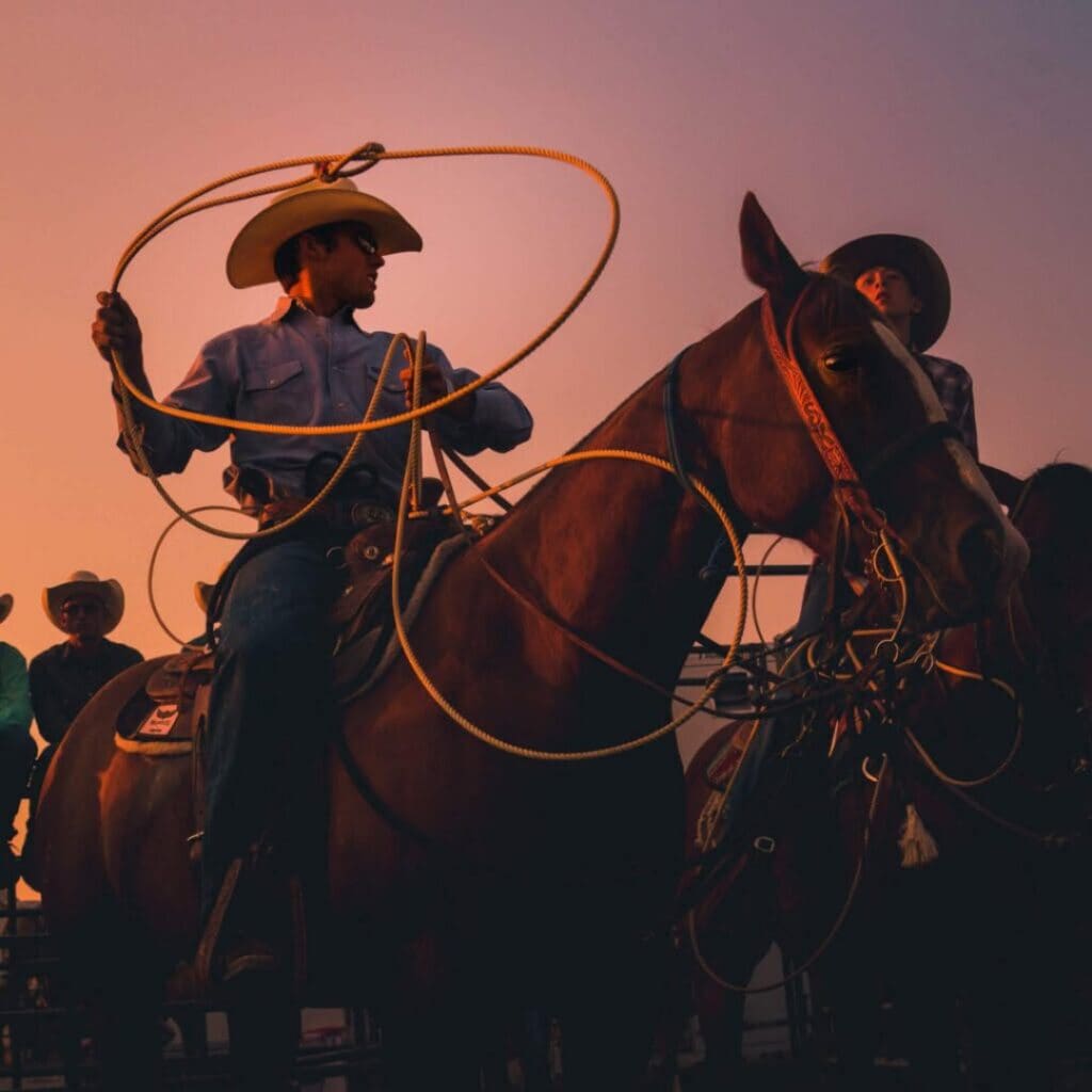 Sun setting over cowboys.  Photo from NHSFR 2026 FB.