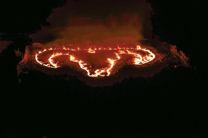 WILD THING Championship outliner of logo on fire in arena