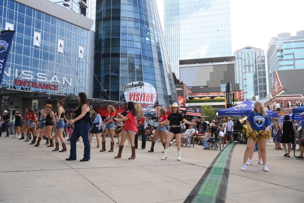 Fans, Dance during the 1st day of the Nashville PBR Teams Event. Photos by Josh Homer. All rights and permissions belong to Bull Stock Media.