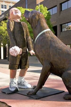 Boy and his dog -Sculpture Walk in South Dakota.  Photo by Niagara Falls Reporter